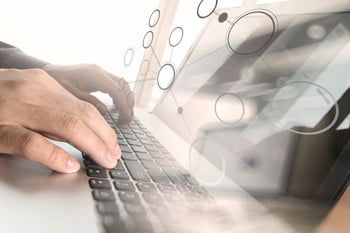 Close up of business man hand working on laptop computer with social media diagram and chart graph on wooden desk as concept-1