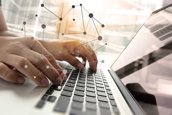 Double exposure of business man hand working on blank screen laptop computer on wooden desk as concept with social media diagram